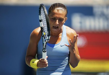Sara Errani of Italy reacts to missing a point against Agnieszka Radwanska of Poland during their women's quarter-finals tennis match of the Sara Errani of Italy reacts to missing a point against Agnieszka Radwanska of Poland during their women's quarter-finals tennis match of the