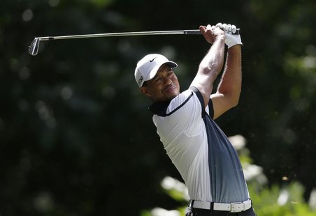 Tiger Woods of the U.S. tees off on the third hole during the third round of the 2013 PGA Championship golf tournament at Oak Hill Country C Tiger Woods of the U.S. tees off on the third hole during the third round of the 2013 PGA Championship golf tournament at Oak Hill Country C