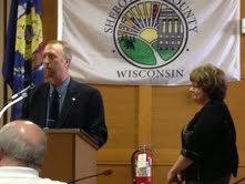 Steve Steinhardt addresses board with Jean Beinemann looking on Steve Steinhardt addresses board with Jean Beinemann looking on