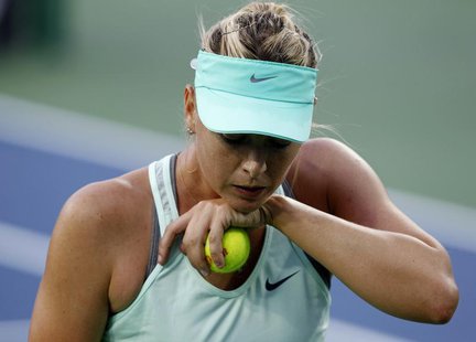 Maria Sharapova of Russia reacts to her play against Sloane Stephens of the U.S. at the women's Cincinnati Open tennis tournament in Cincinn Maria Sharapova of Russia reacts to her play against Sloane Stephens of the U.S. at the women's Cincinnati Open tennis tournament in Cincinn
