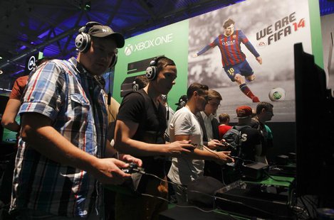 Visitors play "FIFA 14" with the Xbox One at the Microsoft Games exhibition stand during the Gamescom 2013 fair in Cologne August 21, 2013. Visitors play "FIFA 14" with the Xbox One at the Microsoft Games exhibition stand during the Gamescom 2013 fair in Cologne August 21, 2013.