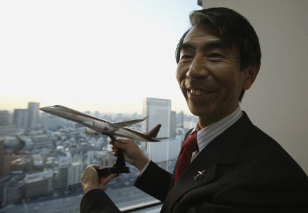 Mitsubishi Aircraft Corp President Teruaki Kawai holds a model of a Mitsubishi Regional Jet (MRJ) after an interview with Reuters in Tokyo F Mitsubishi Aircraft Corp President Teruaki Kawai holds a model of a Mitsubishi Regional Jet (MRJ) after an interview with Reuters in Tokyo F