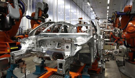 Robots connect side parts on an Audi A3 light weight construction chassis at the production line of the German car manufacturer's plant in t Robots connect side parts on an Audi A3 light weight construction chassis at the production line of the German car manufacturer's plant in t