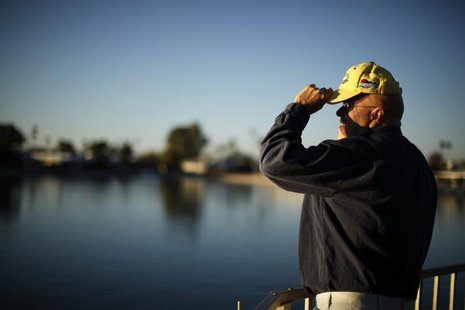 A senior citizen looks out to a lake in Sun City, Arizona, January 4, 2013. REUTERS/Lucy Nicholson A senior citizen looks out to a lake in Sun City, Arizona, January 4, 2013. REUTERS/Lucy Nicholson