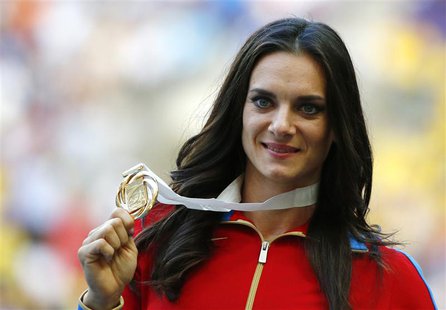 Gold medallist Yelena Isinbayeva of Russia holds her medal at the women's pole vault victory ceremony during the IAAF World Athletics Champi Gold medallist Yelena Isinbayeva of Russia holds her medal at the women's pole vault victory ceremony during the IAAF World Athletics Champi