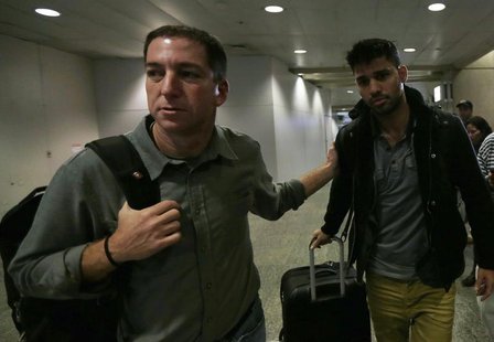 U.S. journalist Glenn Greenwald (L) walks with his partner David Miranda in Rio de Janeiro's International Airport August 19, 2013. REUTERS/ U.S. journalist Glenn Greenwald (L) walks with his partner David Miranda in Rio de Janeiro's International Airport August 19, 2013. REUTERS/