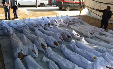 Syrian activists inspect the bodies of people they say were killed by nerve gas in the Ghouta region, in the Duma neighbourhood of Damascus Syrian activists inspect the bodies of people they say were killed by nerve gas in the Ghouta region, in the Duma neighbourhood of Damascus