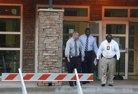 Police investigators are at the front entrance of McNair Discovery Learning Academy after a shooting incident in Decatur, Georgia, August 20 Police investigators are at the front entrance of McNair Discovery Learning Academy after a shooting incident in Decatur, Georgia, August 20