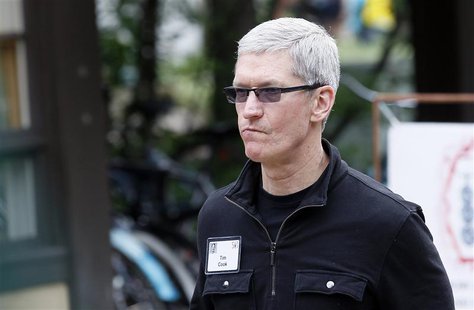 Tim Cook, Apple CEO walks past a news conference being held by Eric Schmidt, executive chairman of Google at the annual Allen and Co. confer Tim Cook, Apple CEO walks past a news conference being held by Eric Schmidt, executive chairman of Google at the annual Allen and Co. confer