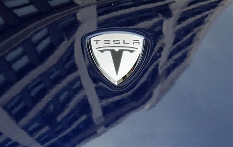 A logo of Tesla Motors on an electric car model is seen outside a showroom in New York June 28, 2010. REUTERS/Shannon Stapleton A logo of Tesla Motors on an electric car model is seen outside a showroom in New York June 28, 2010. REUTERS/Shannon Stapleton