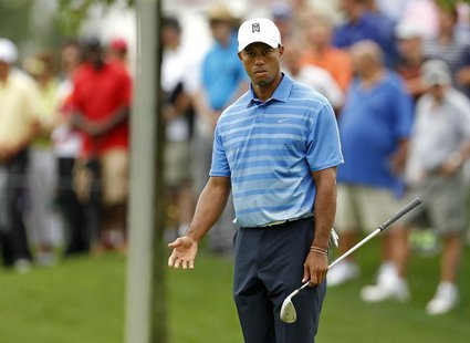 Tiger Woods of the U.S. is seen on the 16th green during the first round of the Barclays PGA golf tournament in Jersey City, New Jersey Augu Tiger Woods of the U.S. is seen on the 16th green during the first round of the Barclays PGA golf tournament in Jersey City, New Jersey Augu