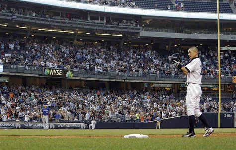 New York Yankees right fielder Ichiro Suzuki tips his cap to the crowd after he singled against the Toronto Blue Jays for his 4000th profess New York Yankees right fielder Ichiro Suzuki tips his cap to the crowd after he singled against the Toronto Blue Jays for his 4000th profess