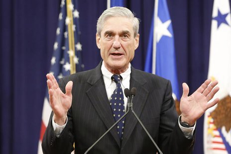 Outgoing FBI Director Robert Mueller reacts to applause from the audience during his farewell ceremony at the Justice Department in Washingt Outgoing FBI Director Robert Mueller reacts to applause from the audience during his farewell ceremony at the Justice Department in Washingt