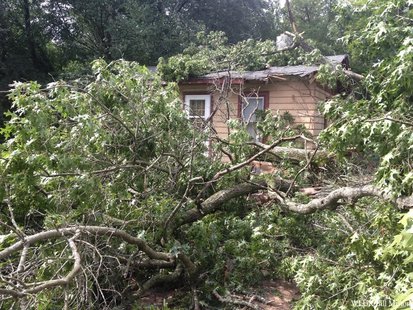 Wednesday evening storms leave Menominee County residents to clean up the mess. A portion of a tree lays across a home and driveway off of County Highway 47 in Keshena in Menominee County. (Photo by: FOX 11). Wednesday evening storms leave Menominee County residents to clean up the mess. A portion of a tree lays across a home and driveway off of County Highway 47 in Keshena in Menominee County. (Photo by: FOX 11).