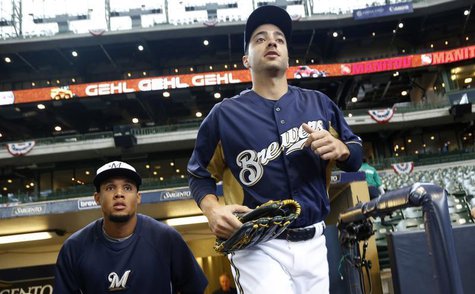 Milwaukee Brewers' Ryan Braun runs onto the field for warm ups before opening day of baseball season as the Brewers take on the Colorado Roc Milwaukee Brewers' Ryan Braun runs onto the field for warm ups before opening day of baseball season as the Brewers take on the Colorado Roc