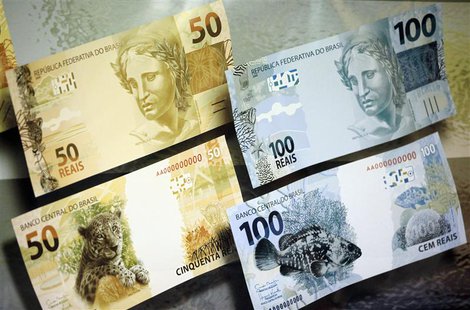 A banner with the new Brazilian real currency notes is seen during a presentation ceremony in Brasilia February 3, 2010. REUTERS/Ricardo Mor A banner with the new Brazilian real currency notes is seen during a presentation ceremony in Brasilia February 3, 2010. REUTERS/Ricardo Mor