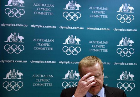 John Coates, President of the Australian Olympic Committee (AOC), reacts as he announces the findings of a probe into the conduct of Austral John Coates, President of the Australian Olympic Committee (AOC), reacts as he announces the findings of a probe into the conduct of Austral