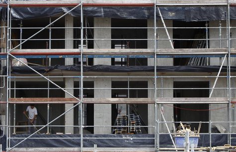 A construction worker is seen while working at a construction area in Munich downtown July 15, 2013. REUTERS/Michaela Rehle A construction worker is seen while working at a construction area in Munich downtown July 15, 2013. REUTERS/Michaela Rehle
