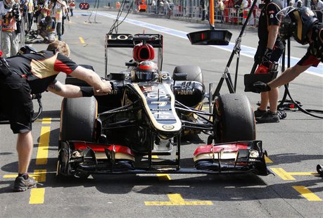 Lotus Formula One driver Kimi Raikkonen of Finland drives into the pit during the second practice session of the Belgian F1 Grand Prix at th Lotus Formula One driver Kimi Raikkonen of Finland drives into the pit during the second practice session of the Belgian F1 Grand Prix at th