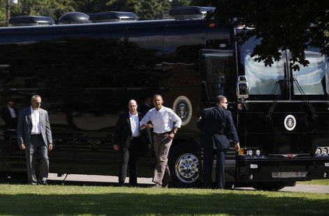 U.S. President Barack Obama steps off his bus upon his arrival at Tully Central High School in Tully, New York August 23, 2013. REUTERS/Jaso U.S. President Barack Obama steps off his bus upon his arrival at Tully Central High School in Tully, New York August 23, 2013. REUTERS/Jaso