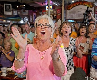 Food Network television personality Paula Deen cheers for her husband Michael Groover during the semi-finals of the "Papa" Hemingway Look-Al Food Network television personality Paula Deen cheers for her husband Michael Groover during the semi-finals of the "Papa" Hemingway Look-Al