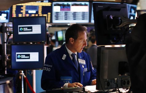 A trader works on the main trading floor of the New York Stock Exchange (NYSE) shortly after the opening bell in New York, May 20, 2013. REU A trader works on the main trading floor of the New York Stock Exchange (NYSE) shortly after the opening bell in New York, May 20, 2013. REU