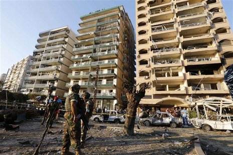 Lebanese army soldiers stand near damaged buildings caused by the two explosions outside two mosques in Lebanon's northern city of Tripoli, Lebanese army soldiers stand near damaged buildings caused by the two explosions outside two mosques in Lebanon's northern city of Tripoli,