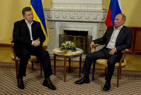 Russian President Vladimir Putin (R) speaks with his Ukrainian counterpart Viktor Yanukovich during their meeting at the Zavidova residence Russian President Vladimir Putin (R) speaks with his Ukrainian counterpart Viktor Yanukovich during their meeting at the Zavidova residence
