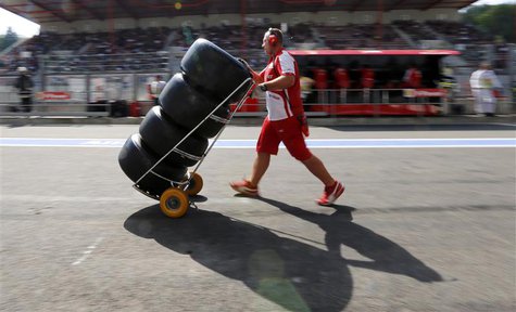 A Ferrari Formula One technician pushes a trolley with Pirelli tyres during the second practice session of the Belgian F1 Grand Prix at the A Ferrari Formula One technician pushes a trolley with Pirelli tyres during the second practice session of the Belgian F1 Grand Prix at the