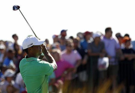Tiger Woods of the U.S. tees off on the 15th hole during the third round of the Barclays PGA golf tournament in Jersey City, New Jersey Augu Tiger Woods of the U.S. tees off on the 15th hole during the third round of the Barclays PGA golf tournament in Jersey City, New Jersey Augu