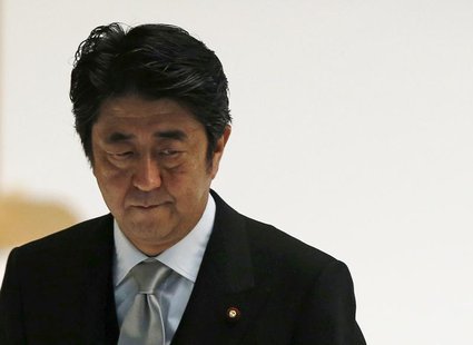 Japan's Prime Minister Shinzo Abe attends a memorial service ceremony marking the 68th anniversary of Japan's defeat in World War Two, at Bu Japan's Prime Minister Shinzo Abe attends a memorial service ceremony marking the 68th anniversary of Japan's defeat in World War Two, at Bu