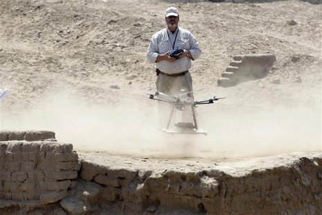 Luis Jaime Castillo, a Peruvian archaeologist with Lima's Catholic University and an incoming deputy culture minister, flies a drone to take Luis Jaime Castillo, a Peruvian archaeologist with Lima's Catholic University and an incoming deputy culture minister, flies a drone to take