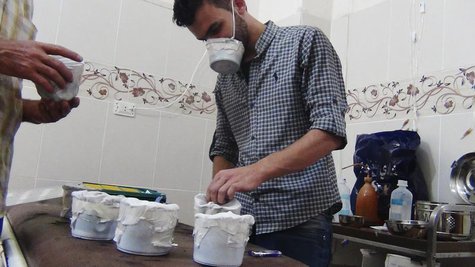Activists and medics manufacture homemade chemical masks in Damascus' suburbs of Zamalka August 23, 2013. REUTERS/Hadi Almonajed Activists and medics manufacture homemade chemical masks in Damascus' suburbs of Zamalka August 23, 2013. REUTERS/Hadi Almonajed