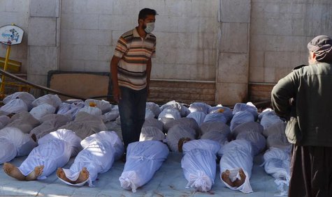ATTENTION EDITORS - VISUALS COVERAGE OF SCENES OF DEATH AND INJURY Syrian activists inspect the bodies of people they say were killed by ner ATTENTION EDITORS - VISUALS COVERAGE OF SCENES OF DEATH AND INJURY Syrian activists inspect the bodies of people they say were killed by ner