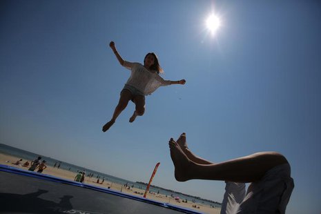 Youths play on a trampoline on the beach in La Baule, July 8, 2013 at the start of the summer holidays. REUTERS/Stephane Mahe Youths play on a trampoline on the beach in La Baule, July 8, 2013 at the start of the summer holidays. REUTERS/Stephane Mahe