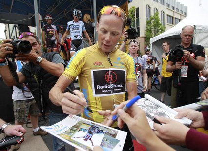 Chris Horner signs autographs before riding in the 82.3-mile Stage-8 of the Amgen Tour of California from Santa Clarita to Thousand Oaks, Ca Chris Horner signs autographs before riding in the 82.3-mile Stage-8 of the Amgen Tour of California from Santa Clarita to Thousand Oaks, Ca