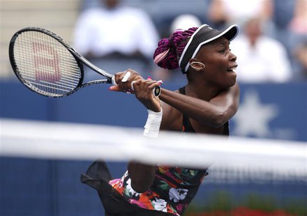 Venus Williams of the U.S. hits a return to Kirsten Flipkens of Belgium at the U.S. Open tennis chammpionships in New York, August 26, 2013. Venus Williams of the U.S. hits a return to Kirsten Flipkens of Belgium at the U.S. Open tennis chammpionships in New York, August 26, 2013.