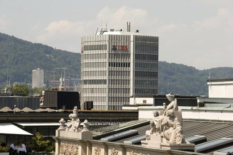 The logo of Switzerland's biggest bank UBS is seen at an office building in Zurich July 25, 2013. REUTERS/Arnd Wiegmann The logo of Switzerland's biggest bank UBS is seen at an office building in Zurich July 25, 2013. REUTERS/Arnd Wiegmann