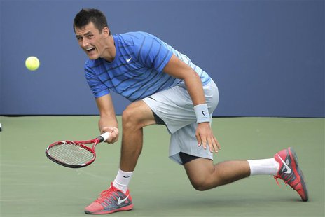 Bernard Tomic of Australia returns to Albert Ramos of Spain at the U.S. Open tennis championships in New York, August 26, 2013. REUTERS/Ray Bernard Tomic of Australia returns to Albert Ramos of Spain at the U.S. Open tennis championships in New York, August 26, 2013. REUTERS/Ray