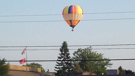 This hot air balloon was spotted over the west side of Kalamazoo Sunday Evening as it lazily floated over the Davenport Campus on West Main. This hot air balloon was spotted over the west side of Kalamazoo Sunday Evening as it lazily floated over the Davenport Campus on West Main.