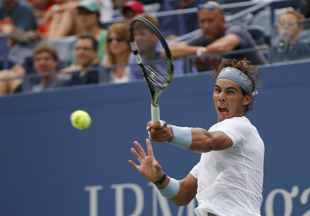 Rafael Nadal of Spain returns to Ryan Harrison of the U.S. at the U.S. Open tennis championships in New York, August 26, 2013. REUTERS/Mike Rafael Nadal of Spain returns to Ryan Harrison of the U.S. at the U.S. Open tennis championships in New York, August 26, 2013. REUTERS/Mike