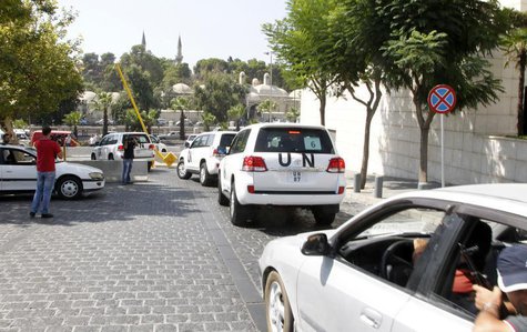 United Nations (U.N.) vehicles transport a team of U.N. chemical weapons experts to the scene of a poison gas attack outside the Syrian capi United Nations (U.N.) vehicles transport a team of U.N. chemical weapons experts to the scene of a poison gas attack outside the Syrian capi