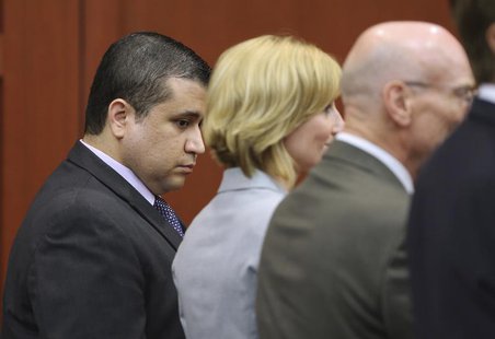George Zimmerman looks down as his defense team Don West (R), and Lorna Truett (C), react upon hearing the verdict in Zimmerman's 2012 shoot George Zimmerman looks down as his defense team Don West (R), and Lorna Truett (C), react upon hearing the verdict in Zimmerman's 2012 shoot