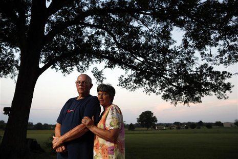 Norman and Mary Mahan are seen outside their home in Wooster, Arkansas, August 5, 2013. REUTERS/Jim Young Norman and Mary Mahan are seen outside their home in Wooster, Arkansas, August 5, 2013. REUTERS/Jim Young