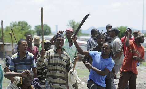 Strikers chants slogans outside the Anglo American Platinum (Amplats) mines near Rustenburg, 120 km (70 miles) northwest of Johannesburg Oct Strikers chants slogans outside the Anglo American Platinum (Amplats) mines near Rustenburg, 120 km (70 miles) northwest of Johannesburg Oct