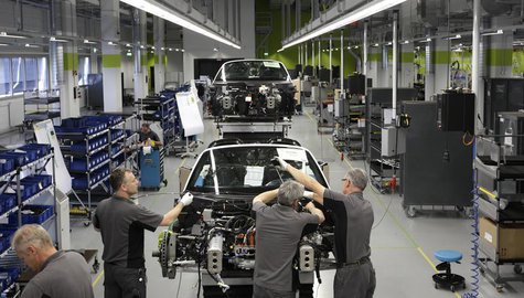 Electricians assemble a new Porsche 918-Spyder sports car at the production line of the German car manufacturer's plant in Stuttgart-Zuffenh Electricians assemble a new Porsche 918-Spyder sports car at the production line of the German car manufacturer's plant in Stuttgart-Zuffenh