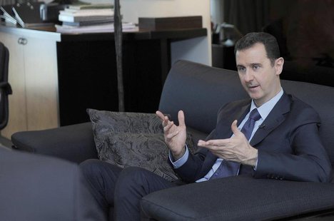Syria's President Bashar al-Assad speaks during an interview with a Russian newspaper in Damascus, in this handout photograph distributed by Syria's President Bashar al-Assad speaks during an interview with a Russian newspaper in Damascus, in this handout photograph distributed by