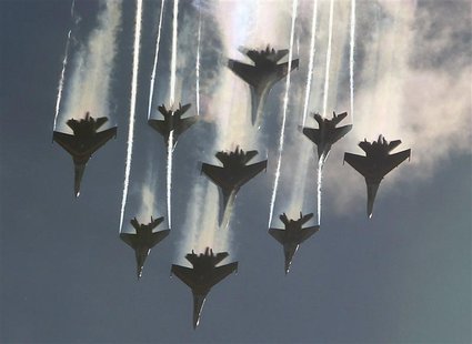 MiG-29 jet fighters of the Strizhi (Swifts) and Sukhoi Su-27 jet fighters of the Russkiye Vityazi (Russian Knights) aerobatic teams perform MiG-29 jet fighters of the Strizhi (Swifts) and Sukhoi Su-27 jet fighters of the Russkiye Vityazi (Russian Knights) aerobatic teams perform