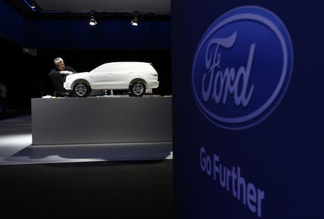 A Ford employee works on a model at a media event to launch a concept car in Sydney August 13, 2013. REUTERS/Daniel Munoz A Ford employee works on a model at a media event to launch a concept car in Sydney August 13, 2013. REUTERS/Daniel Munoz