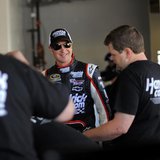 NASCAR Sprint Cup Series driver Kurt Busch (C) speaks to members of his crew next to his number 51 car in the garage area at Daytona Interna NASCAR Sprint Cup Series driver Kurt Busch (C) speaks to members of his crew next to his number 51 car in the garage area at Daytona Interna